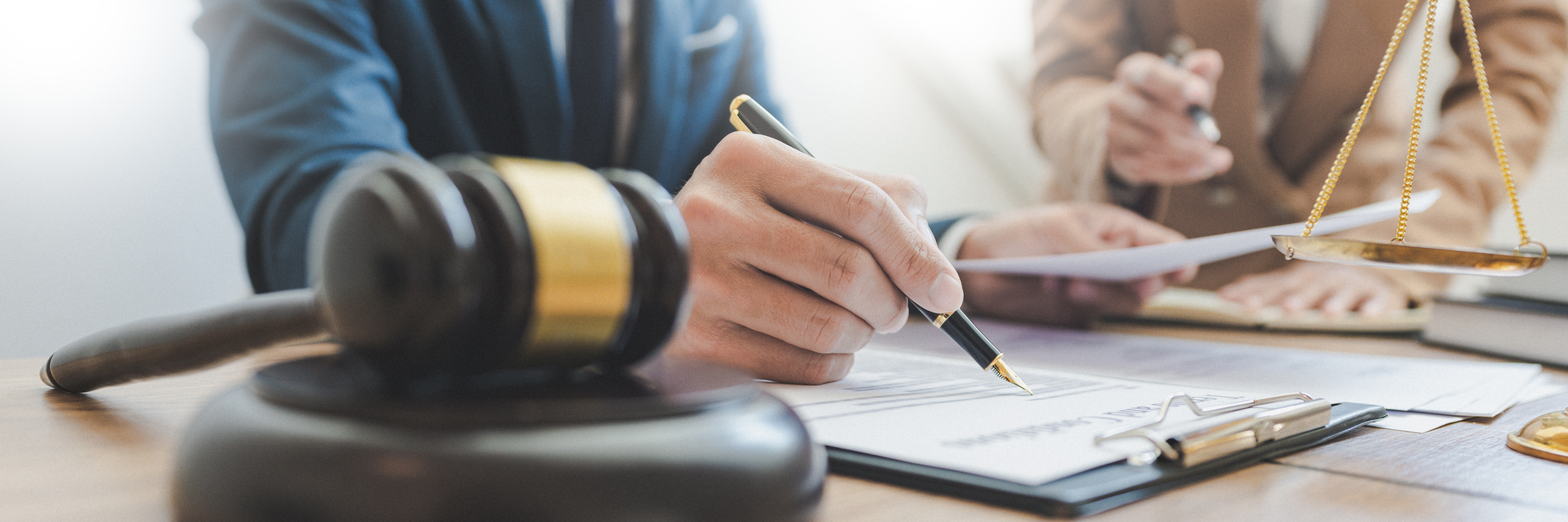 Lawsuit and justice concept, Lawyer working with partner at law firm. legal consulting discussion defendant punishment law in courtroom.